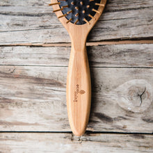 Load image into Gallery viewer, Bamboo Hairbrush on Black - Oval - Life Before Plastik
